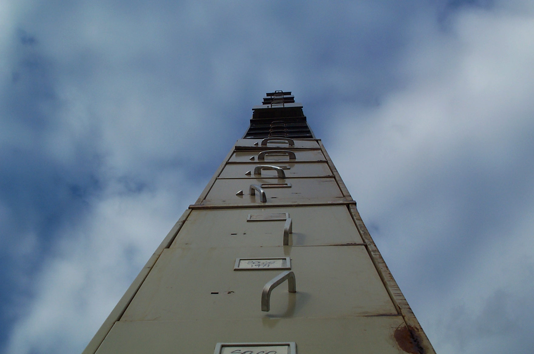 A tower of filing cabinets set against the sky